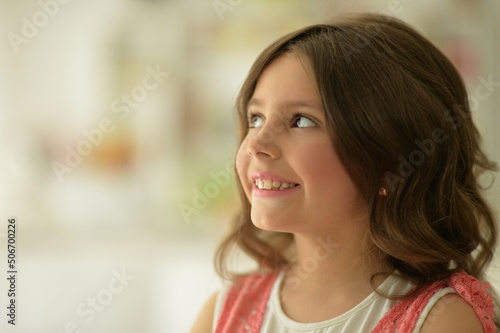 beautiful happy girl looking away indoors