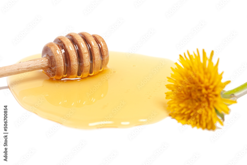 Wooden dipper with honey and dandelion isolated on a white background. Golden organic floral honey natural. Wooden dipper with honey and dandelion isolated on a white background. Golden organic floral honey natural.