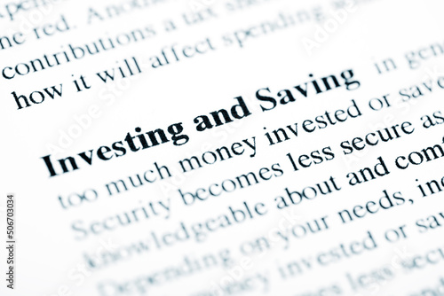 Investing and Saving Text Macro Shot On Printed Paper