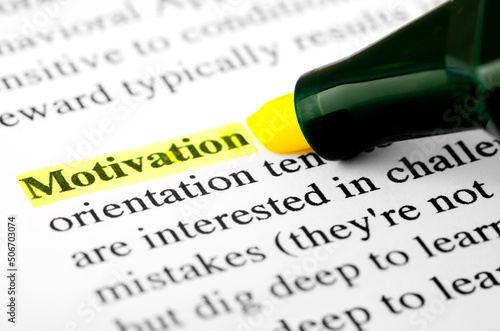 Motivation Text Macro Shot Highlighted with a Highlighter in Yellow Color On Printed Paper