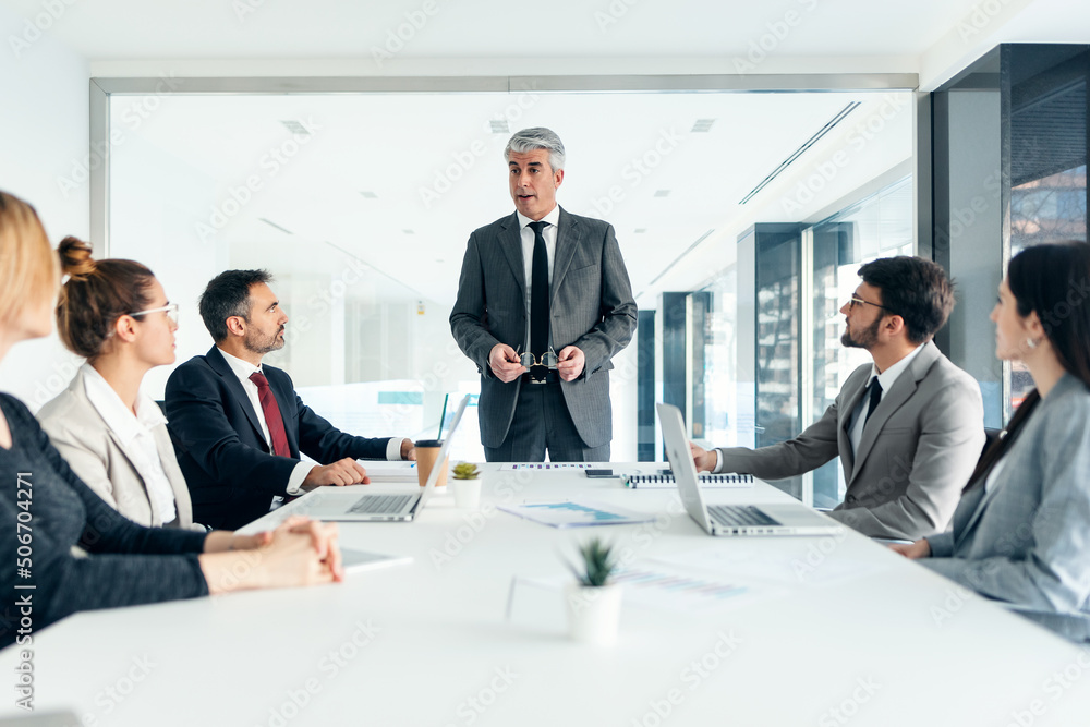 Successful business team doing a meeting to talk about work in a modern startup. Successful business team doing a meeting to talk about work in a modern startup.