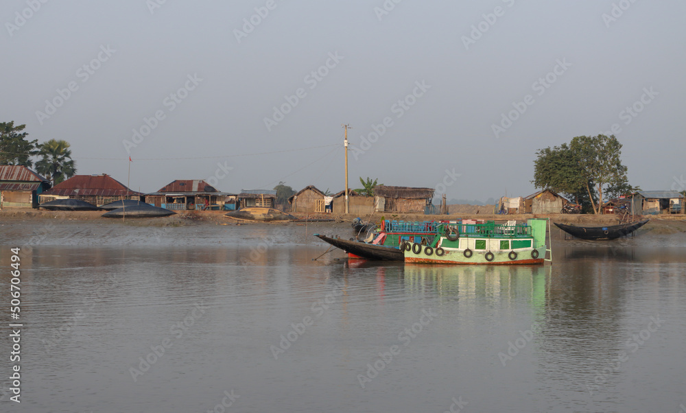 Naklejka premium Fishermen village on the bank of Poshur River near Sundarbans,Bangladesh.