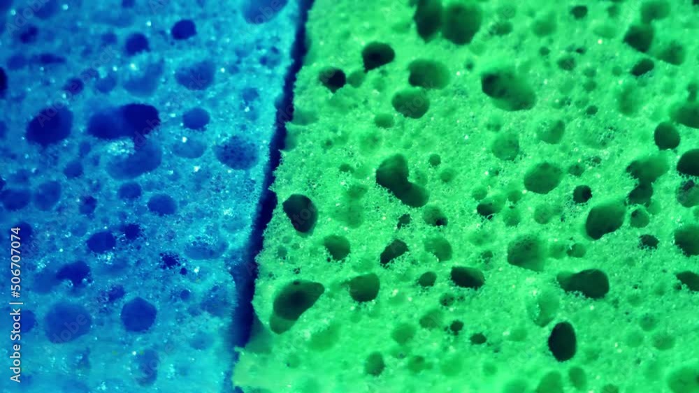 Several colorful sponges taken in close-up. 4k macro video. Soft porous material. Washcloths for washing dishes. Highly detailed video.