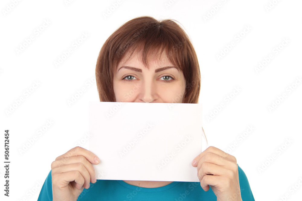 Smiling Woman Holding Empty White Poster Advertising Something Standing On Gray Studio Background. Mockup Smiling Woman Holding Empty White Poster Advertising Something Standing On Gray Studio Background. Mockup