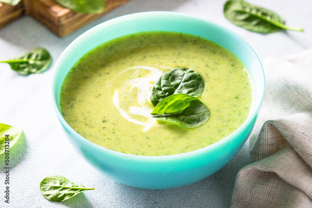 Green soup. Spinach cream soup with cream. Healthy vegan dish. Close up. Green soup. Spinach cream soup with cream. Healthy vegan dish. Close up.