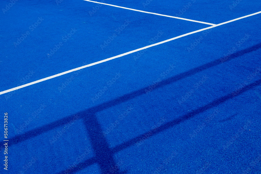 Blue paddle tennis court with artificial grass