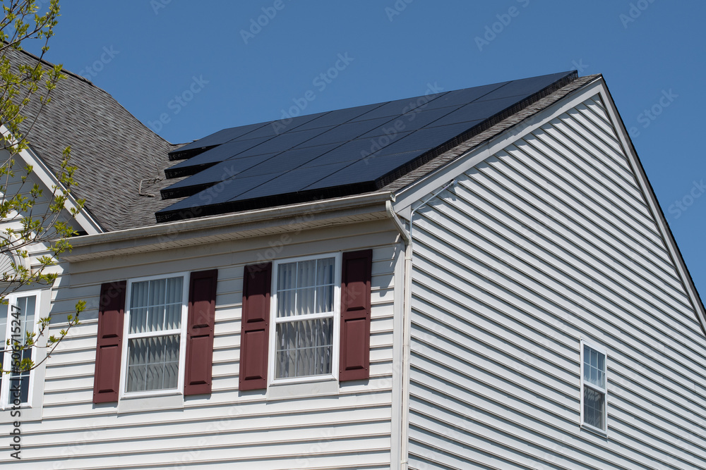 Modern houses with solar panels on the roof for alternative energy