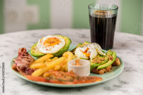 breackfast with avocado, bacond and fries photo