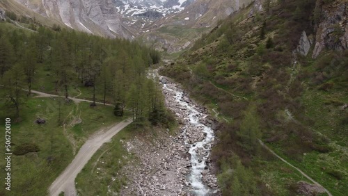 Brook from a mountain, rustic vibe, drone fly down 