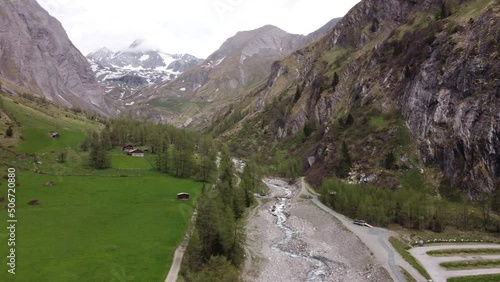 Brook, trees and mountains, semi orbit shot