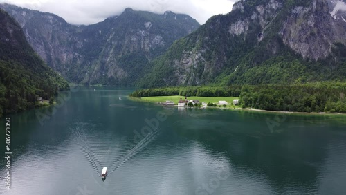 Europe boat on a lake surrounded by mountains