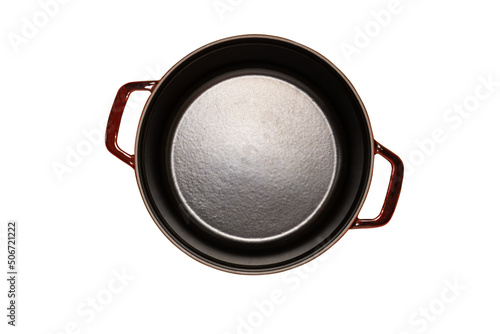 Empty cast iron pot top view, isolated on white background