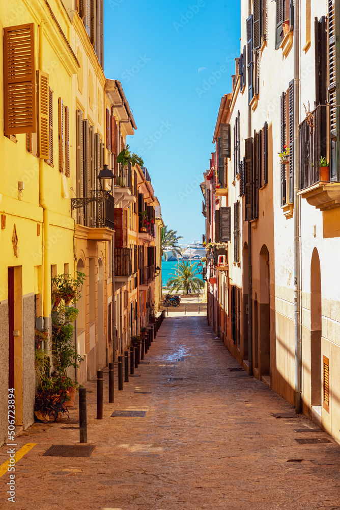 Old street in Palma de Mallorca overlooking the sea