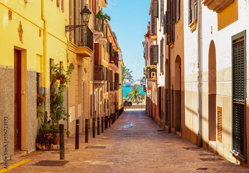 Fototapeta Naklejka Na Ścianę i Meble -  Old street in Palma de Mallorca overlooking the sea