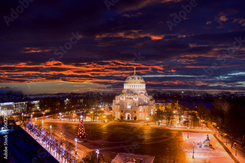 Russian Christmas. Christmas panorama from the air. Christmas tree near the St. Nicholas Cathedral in Kronstadt. Celebrating the New Year in Russia. Festive evening city from a height. Russian cities