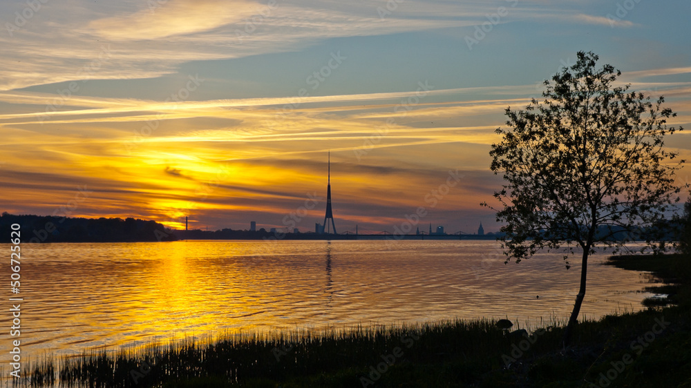 sunset on the river, in the photo the Daugava river in the evening