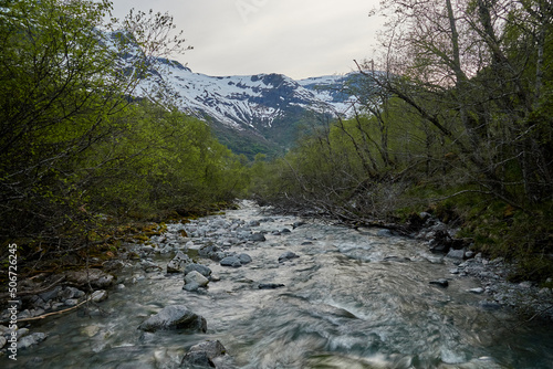 Briksdalasbreen glacier. Sunset. Glacier waterfall. Sheep. Authentic Norwegian house. Spring in Norway. Jostedalsbreen National Park.