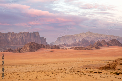 Red sands, mountains, dramatic sky and marthian landscape panorama of Wadi Rum desert, Jordan