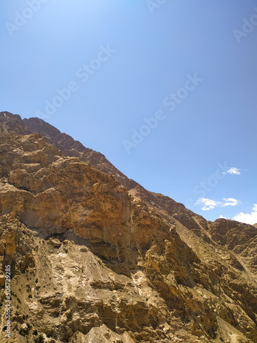 Sand mountain on the blue sky background