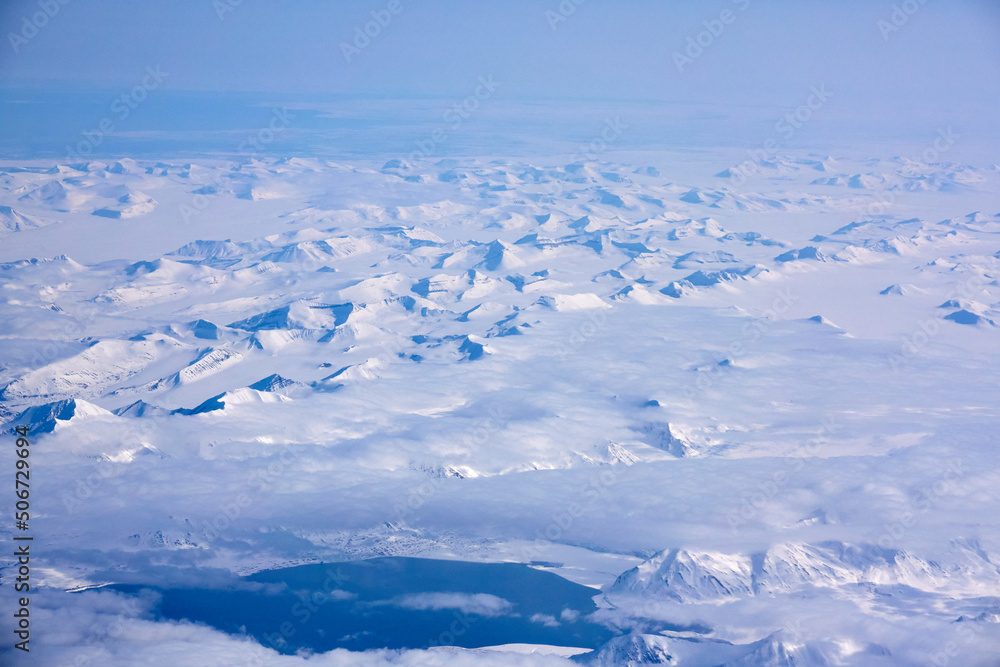 Obraz premium Svalbard. Snow in late spring. Midnight sun. Snowmobiles and Boats. Sun and clouds. Glaciers. North Pole. Ice and Iceberg. Ice caves. Reindeers. Norway.