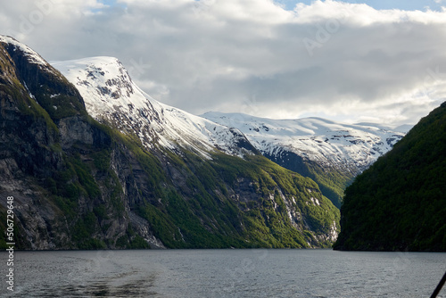 Geirangerfjord. Spring in the norwegian fjords. Reflections. Fishing. Waterfalls. Trees. Boats. Light and clouds.  © Ramil