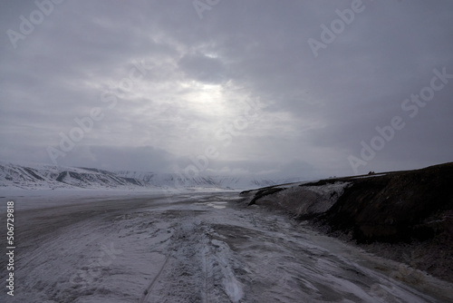 Svalbard. Snow in late spring. Midnight sun. Snowmobiles and Boats. Sun and clouds. Glaciers. North Pole. Ice and Iceberg. Ice caves. Reindeers. Norway.