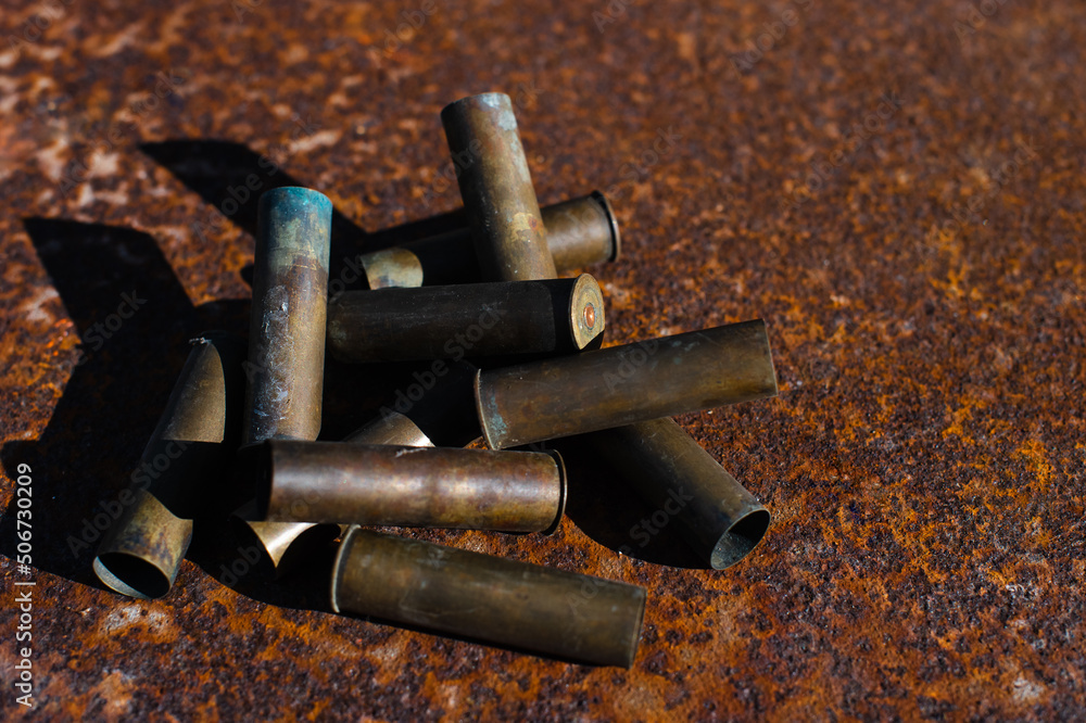 smoking spent cartridge cases from a hunting rifle, murder, danger, war smoking spent cartridge cases from a hunting rifle, murder, danger, war