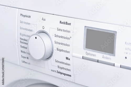 Modern white washing machine front panel with display
