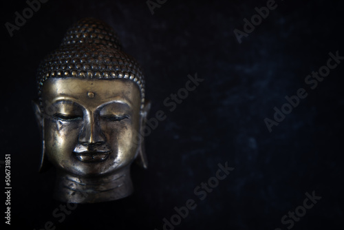 Wallpaper Mural Buddha head on dark black simple background. Left image. Torontodigital.ca