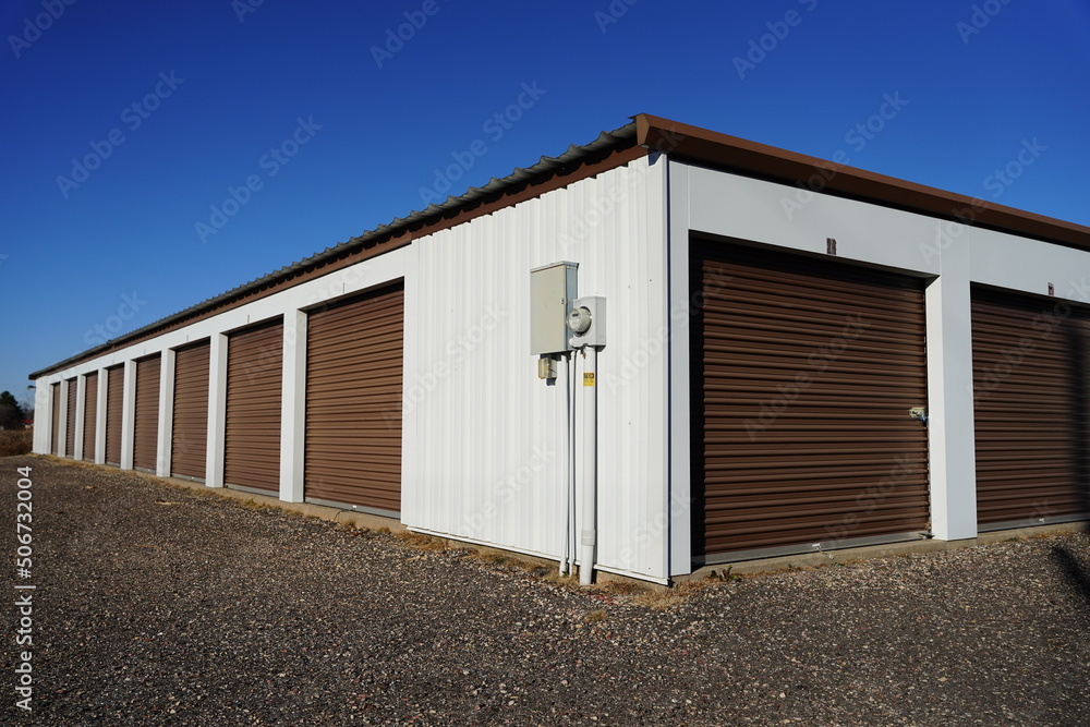Storage unit buildings sit outside holding the owner's property.