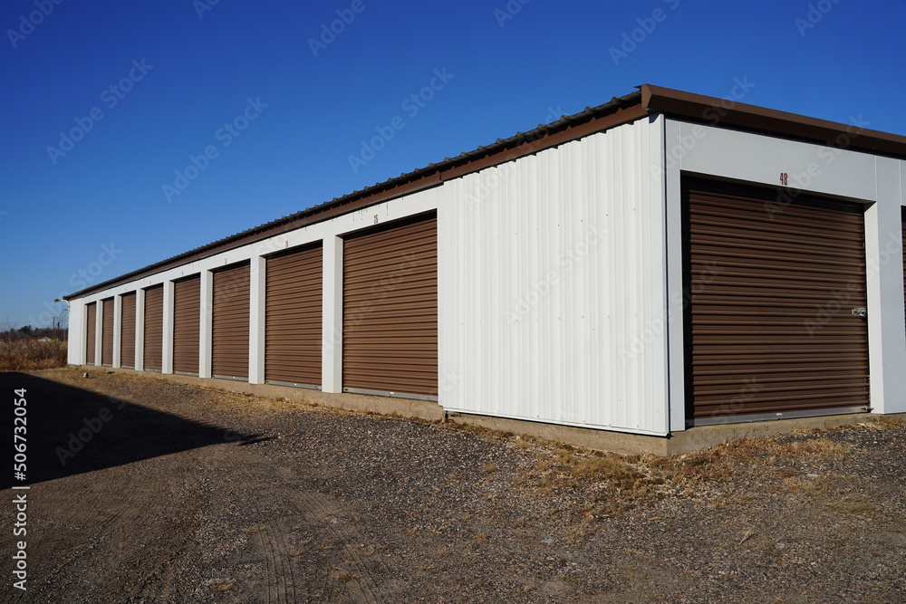 Storage unit buildings sit outside holding the owner's property.