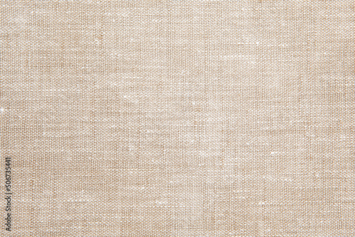 Textured background from natural linen fabric, natural color. 