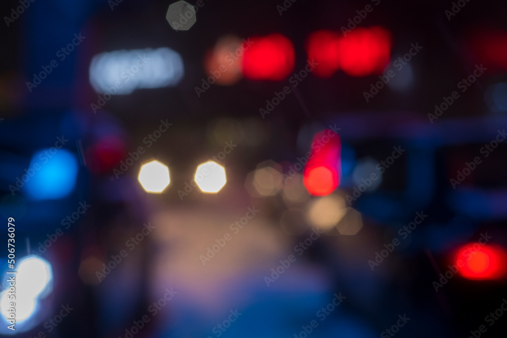 multi-colored bokeh from the light of car headlights in the night city