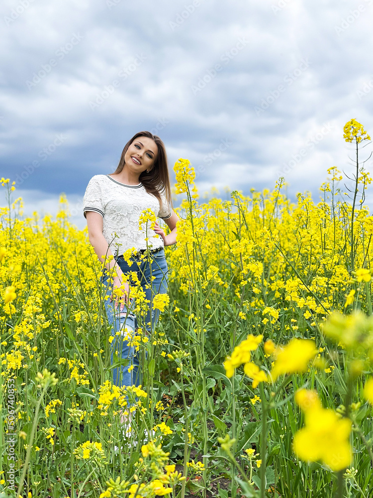 Lovely young woman in bright yellow field Lovely young woman in bright yellow field