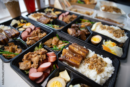 Taiwanese bento box delivery takeaway ready to go, sets of braised pork, Taiwanese sausage, fried chicken, braised pork rice, Lu Rou Fan combo