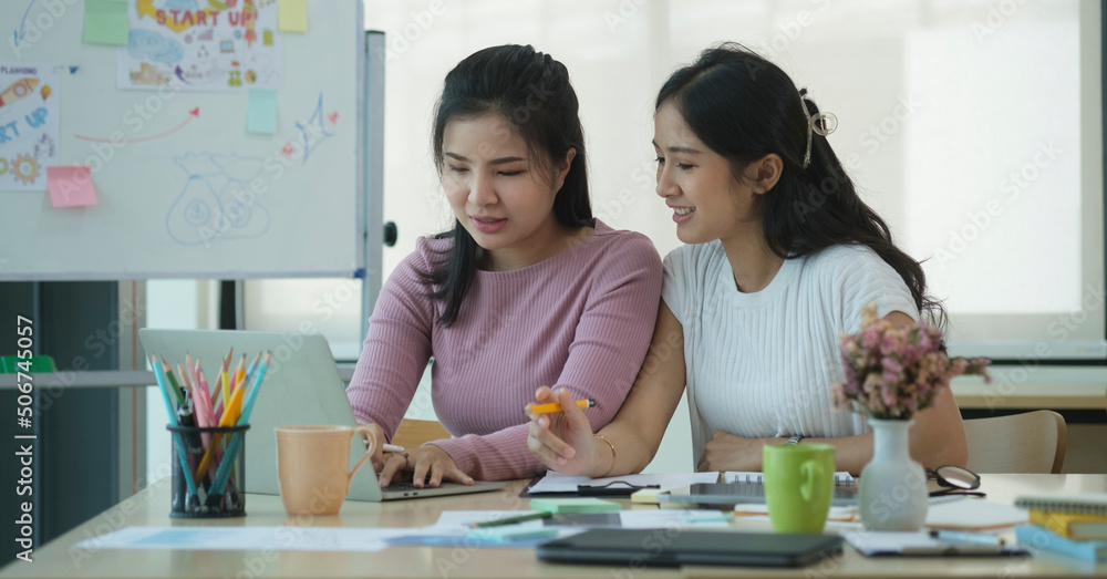 Happy female employees having fun together while discussing successful project in creative office. Happy female employees having fun together while discussing successful project in creative office.