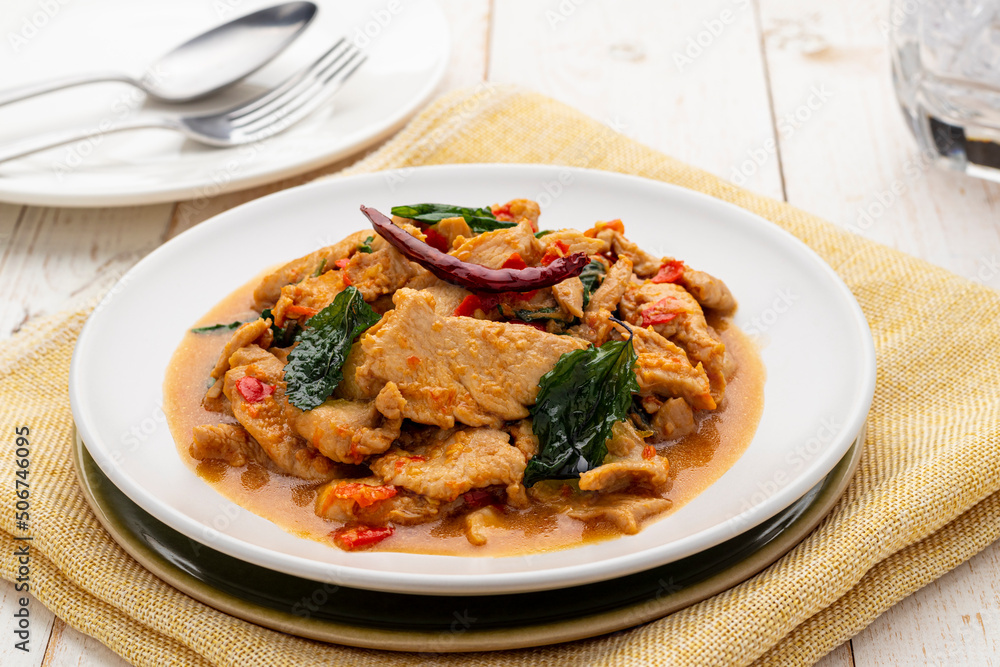 Pad kra pao gai, chicken stir-fried with chili, garlic and holy basil leaves to create this hot-spicy delicious dish. It is a popular simple Thai menu served from street food carts to restaurants. Pad kra pao gai, chicken stir-fried with chili, garlic and holy basil leaves to create this hot-spicy delicious dish. It is a popular simple Thai menu served from street food carts to restaurants.