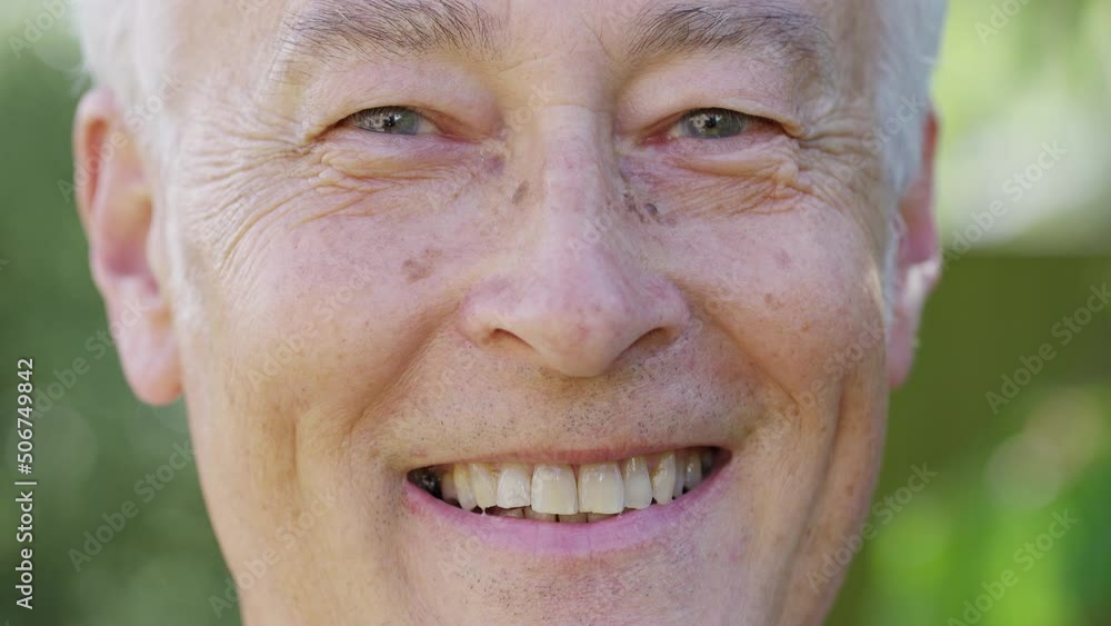 Close portrait of senior white male looking to camera and smiling Close portrait of senior white male looking to camera and smiling