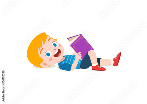 little kid lay down and read book