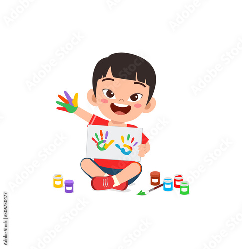 little kid make painting with hand stamp