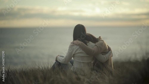 comforting friendly hug friends hugging empathy compassion sunset slow motion photo