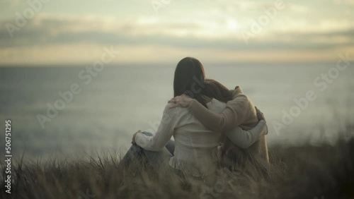 comforting friendly hug friends hugging empathy compassion sunset slow motion
