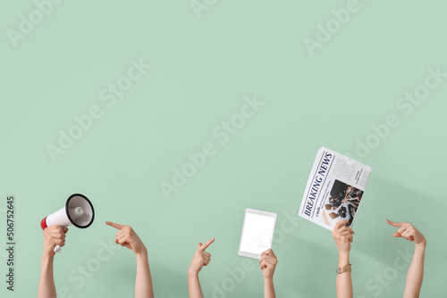 People with newspaper, tablet computer and megaphone on green background