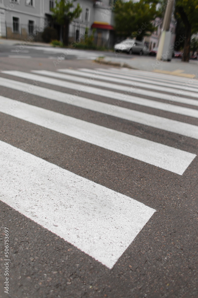 Obraz premium Zebra crosswalk on road in city