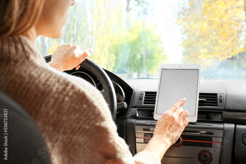 Female driver using tablet ...