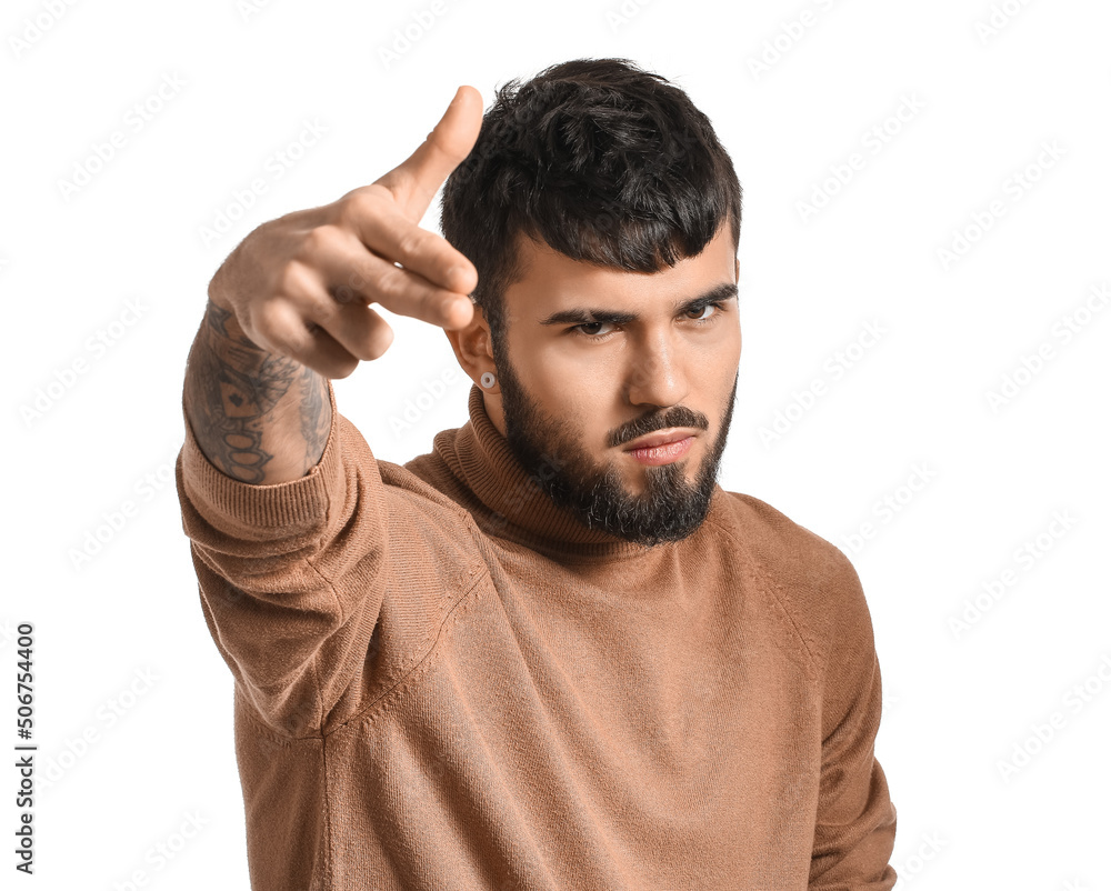 Young man with beard pointing at viewer on white background Young man with beard pointing at viewer on white background
