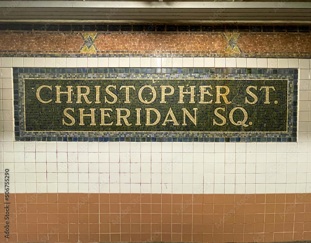 New York, NY - USA - May 20, 2022 The colorful ceramic tile mosaic sign of the Christopher Street–Sheridan Square station, a local station on the IRT Broadway–Seventh Ave Line of the NYC Subway.