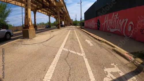 Chicago, IL USA May 18th 2020: Hyper lapse of a cyclist driving through the residential city of Chicago during day light from a first person point of view. Its a great for tourist visiting the area