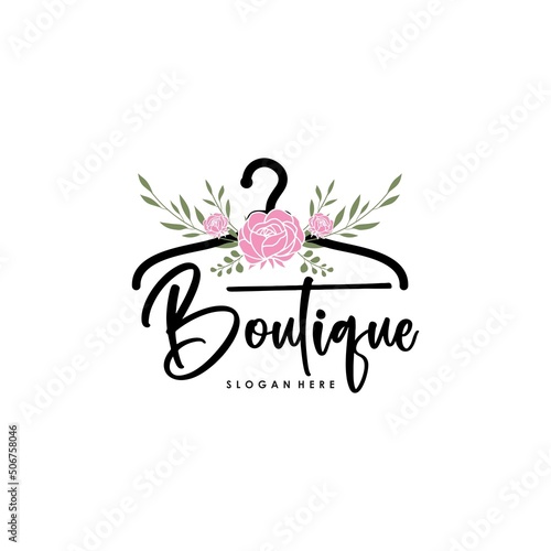 The concept of a coat hanger logo with roses for the clothing collection boutique logo template photo