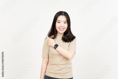 Showing Product and Pointing Side Of Beautiful Asian Woman Isolated On White Background
